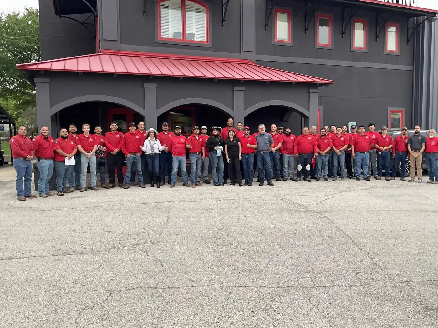 The whole Cowboy's crew lined up outside headquarters