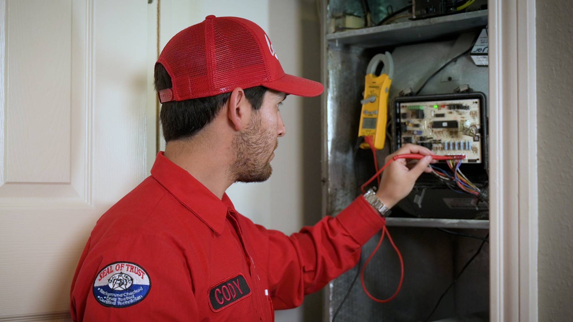 SERVICE-TECH-WORKING-ON-FURNACE